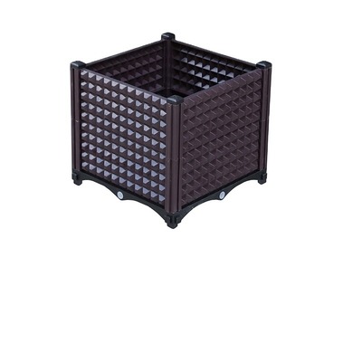 Le grand planteur en plastique rectangulaire antirouille de jardin enferme dans une boîte entreposable pour la plantation d'arbres
