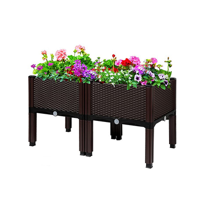 Le plastique adapté aux besoins du client extérieur d'intérieur a soulevé des planteurs de jardin sur l'antigel de jambes